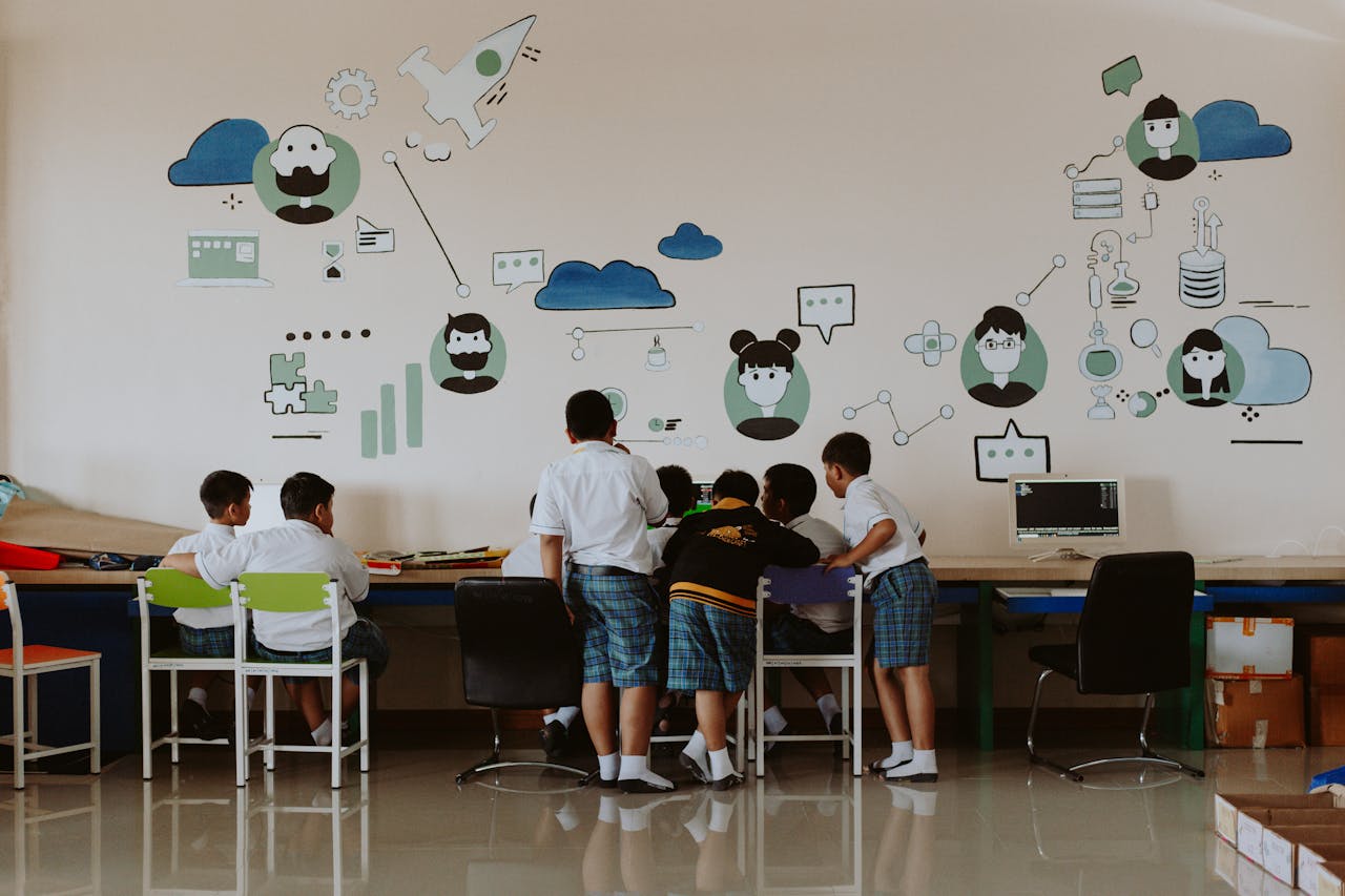 About Students exploring technology in a colorful classroom environment, fostering education.